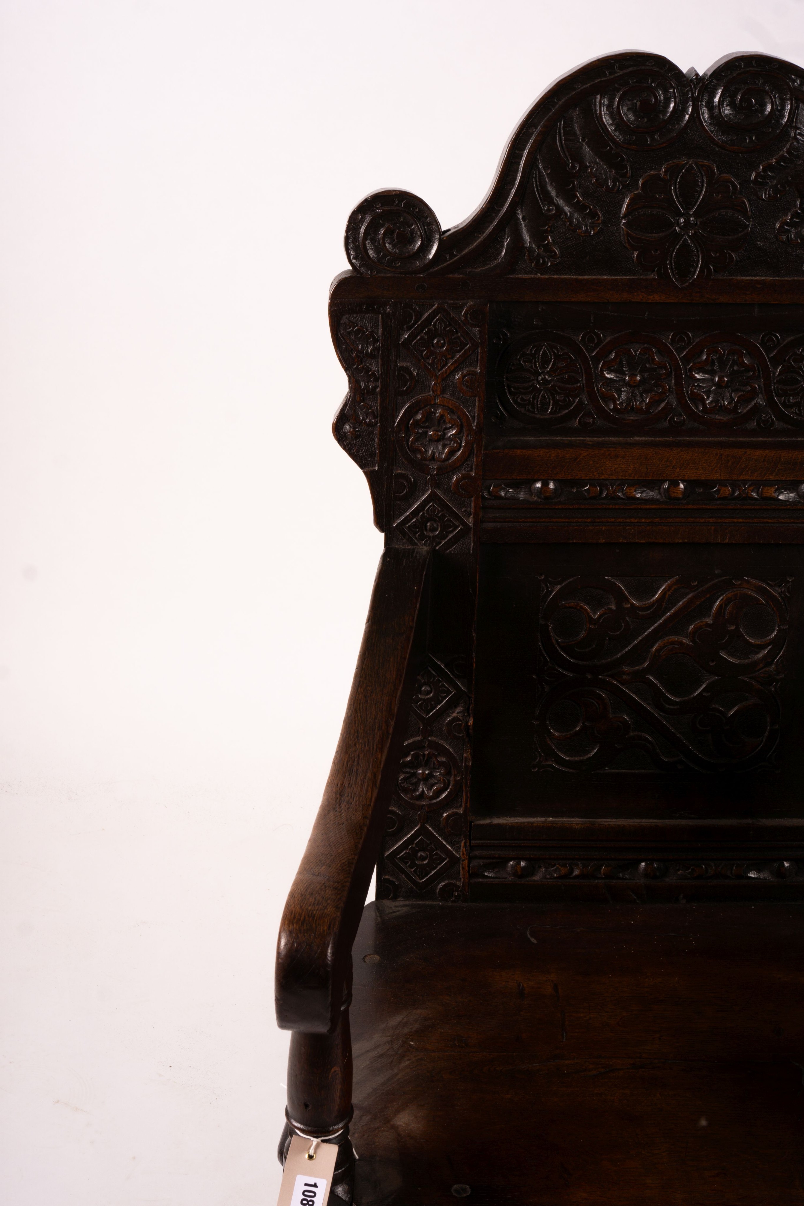 A 17th century Yorkshire area carved oak wainscot chair, width 62cm, depth 48cm, height 118cm